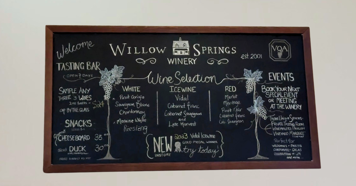 Signage displaying wine selections at Willow Springs Winery, including Riesling, Meritage, and Vidal Icewine.
