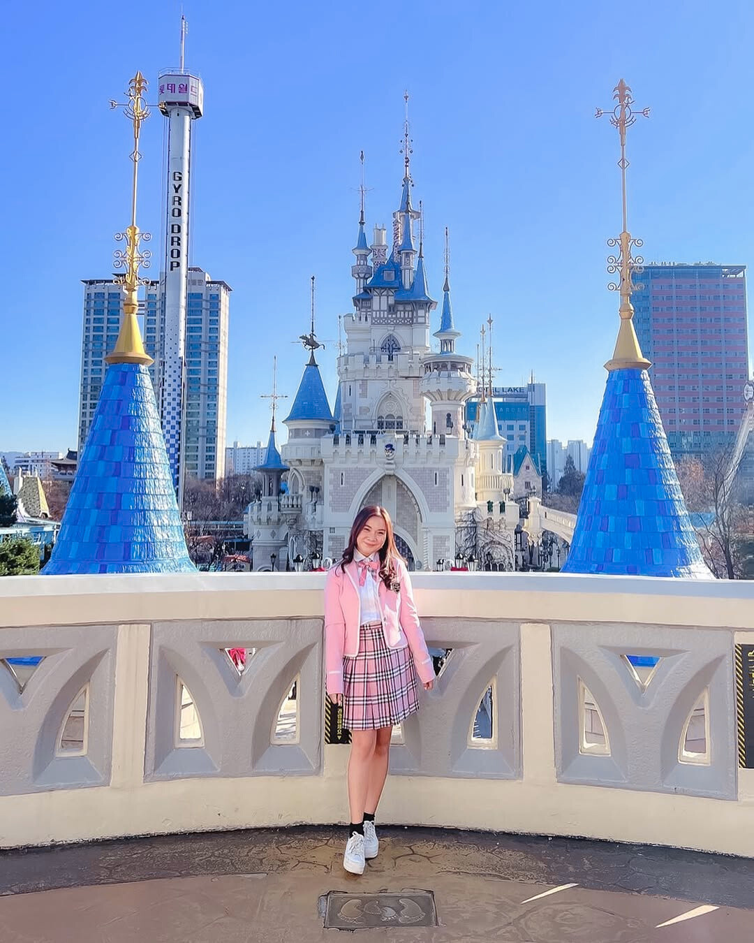 Roxanne Lacap wearing a pink Korean high school uniform rental at Lotte World castle Seoul Korea BTS Run filming location