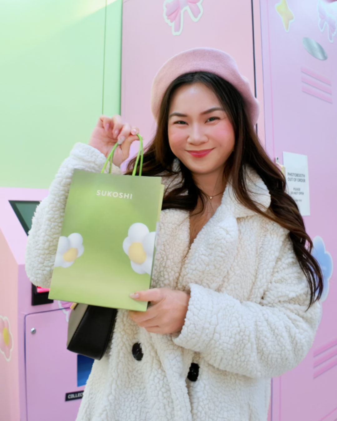Roxanne Lacap Toronto content creator holding Sukoshi Mart shopping bag of kbeauty store