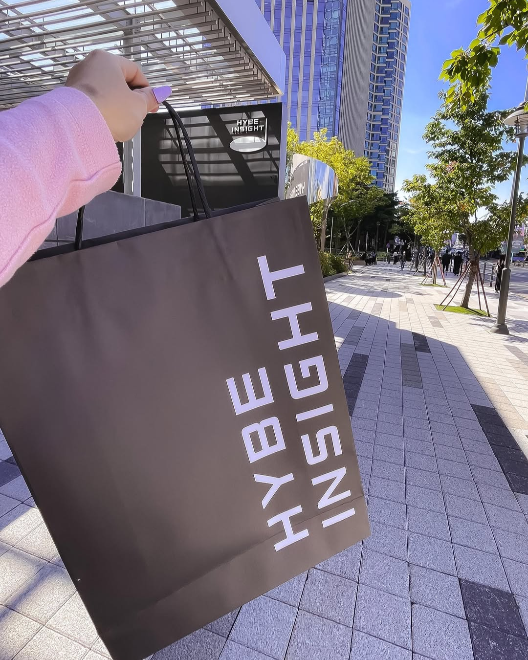 BTS ARMY holding a HYBE Insight shopping bag outside the HYBE building in Yongsan Seoul Korea