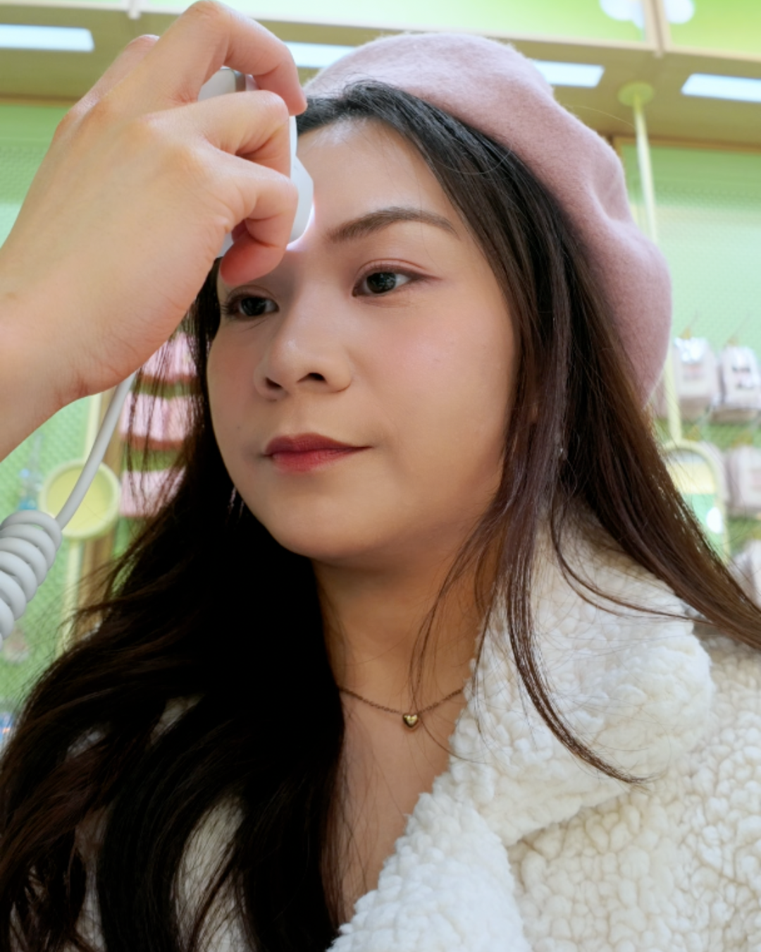 Roxanne Lacap Toronto influencer getting skin type test done with analysis device at Sukoshi Mart