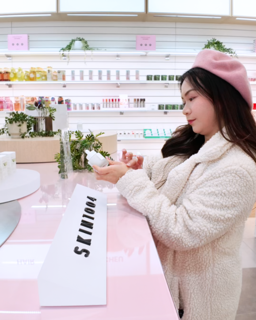 Roxanne Lacap Toronto content creator holding Skin1004 skincare products at Sukoshi Mart skin analysis event