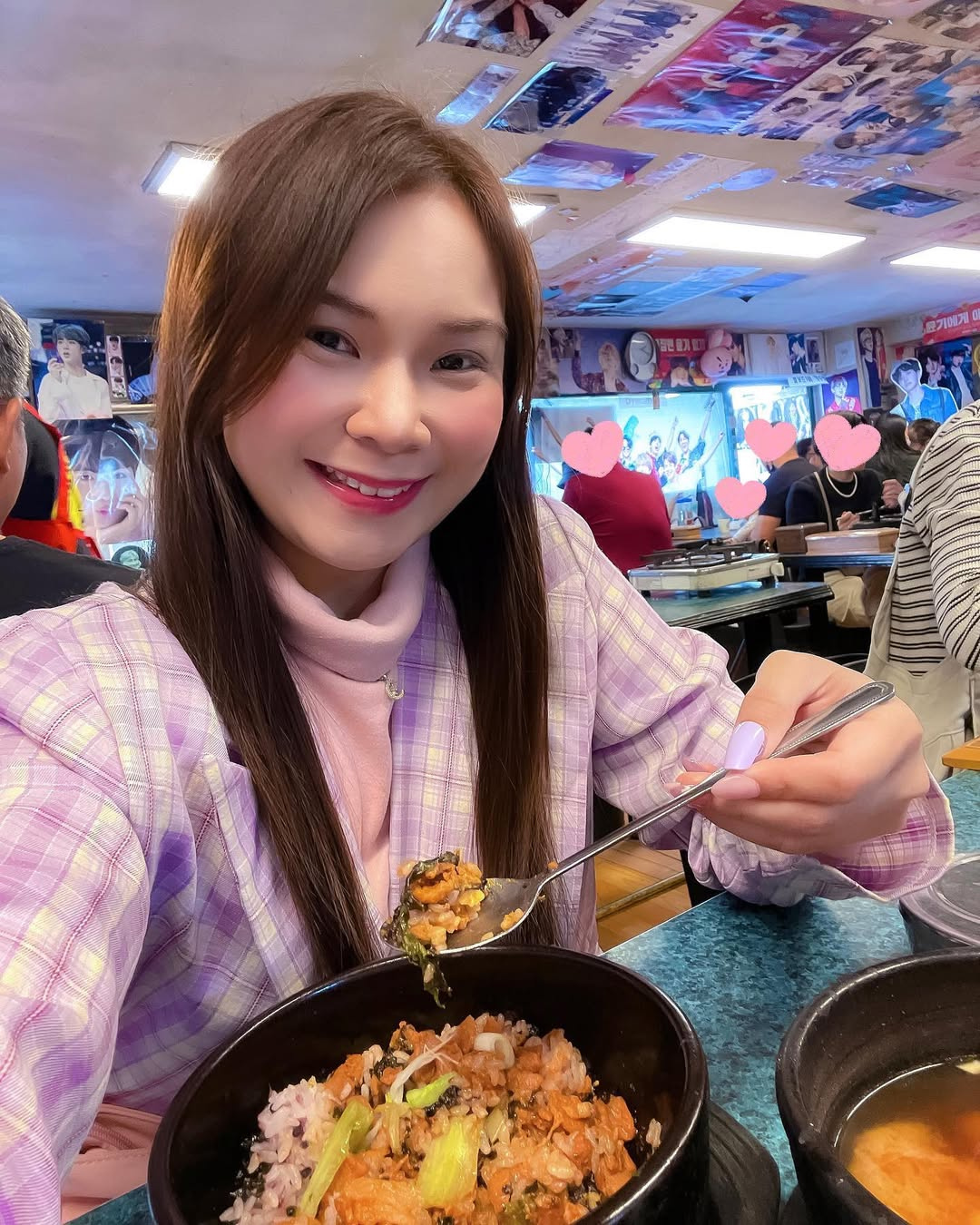 BTS ARMY eating at Yoojung Sikdang the BTS trainee days restaurant in Seoul with BTS photos covering the walls and ceiling