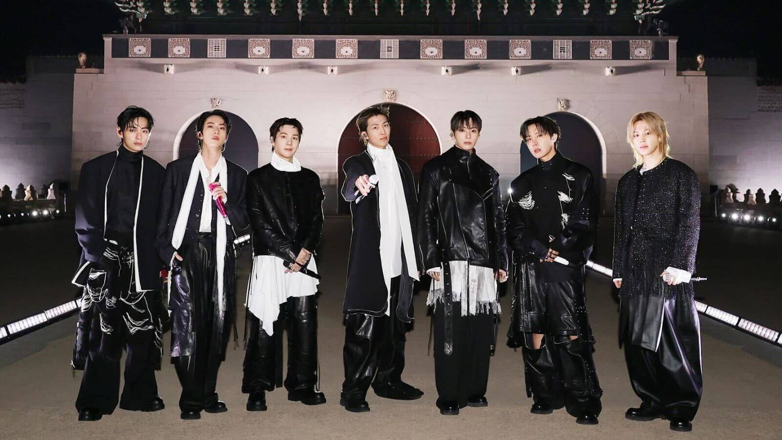 All seven members of BTS standing in front of Gwanghwamun Gate for their ARIRANG Netflix concert. The Gwanghwamun Gate is a must-visit for every ARMY celebrating Festa 2026 and for the ARIRANG World Tour Concert Seoul travel guide 