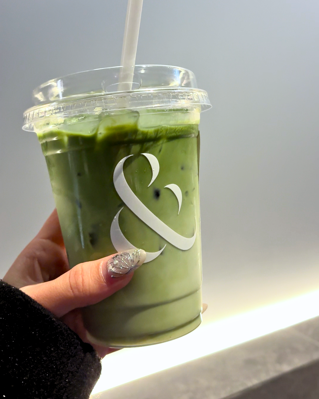 An iced matcha latte drink from the AndBanhMi menu in Toronto